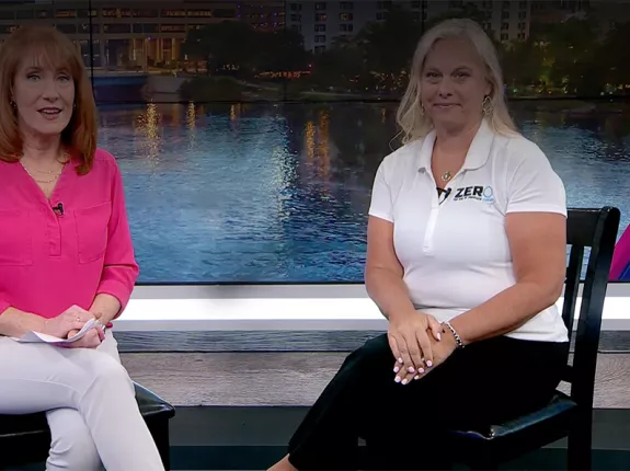 Chapter Manager Tracy Cameron sitting with a reporter