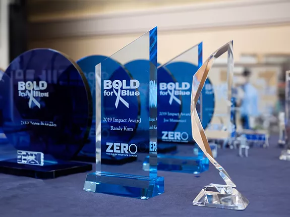 A table with several Bold for Blue awards