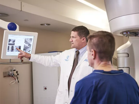 Doctor and patient looking at radiation imaging