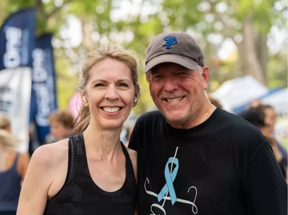 Man and woman smiling posing