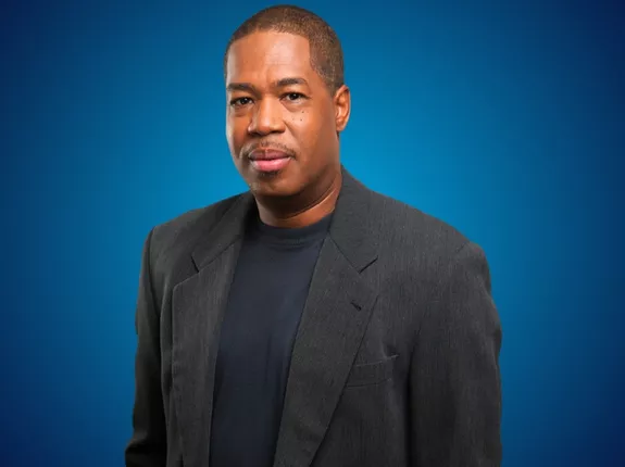 Picture of Senior writer at Andscape, Jerry Bembry wearing a black suit
