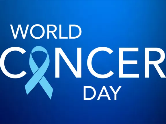 Blue background with the words "World Cancer Day", with a blue prostate cancer ribbon replacing the "a" in the word "cancer"