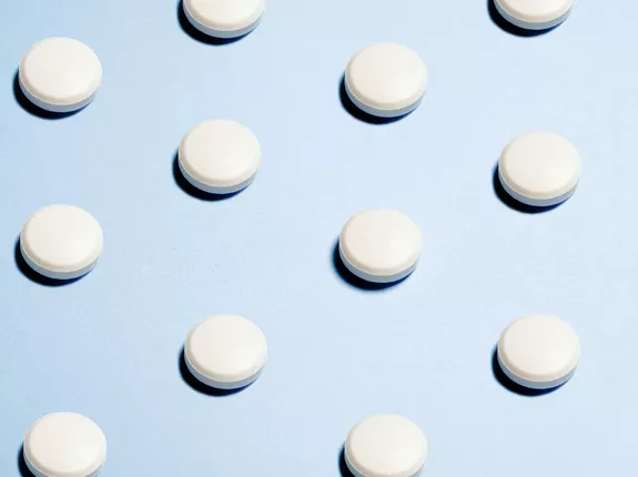 White Pills with blue background
