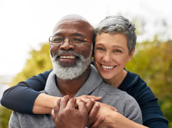 Couple smiling and hugging