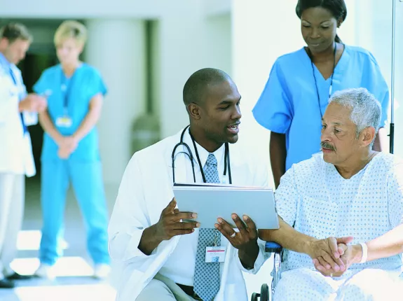 Depiction of medical team talking to a man