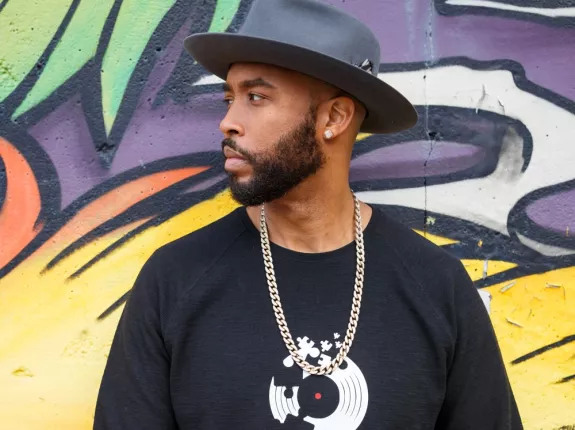 Montell Jordan Standing in Front of Mural