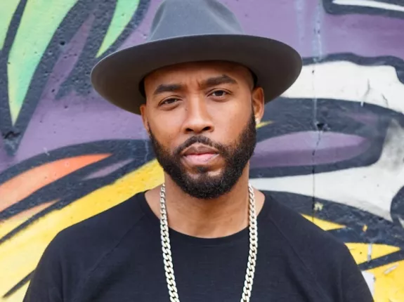 Montell Jordan Standing in Front of Mural