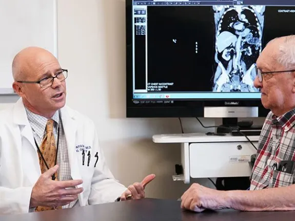 Man talking with a doctor in a medical office
