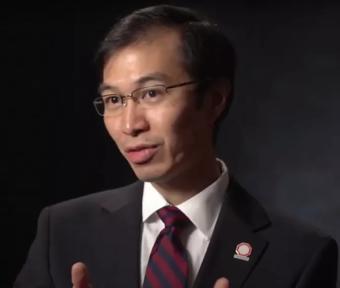 Dr. Eric Shinohara speaking during a video recording