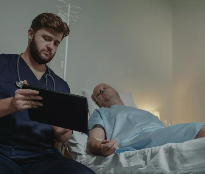 Middle age man at a hospital with a doctor