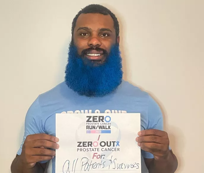 Young African American man, Josh Woods, with a blue beard