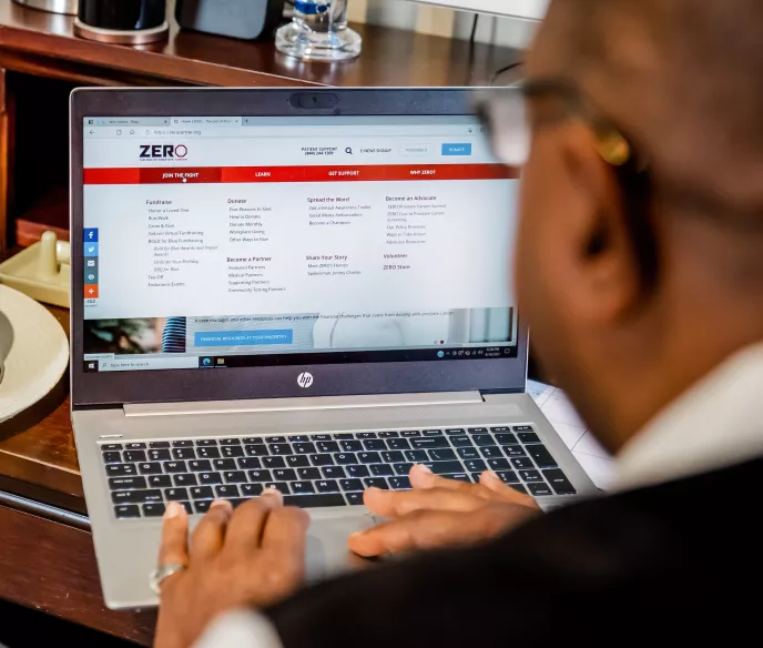 African American man working on a laptop