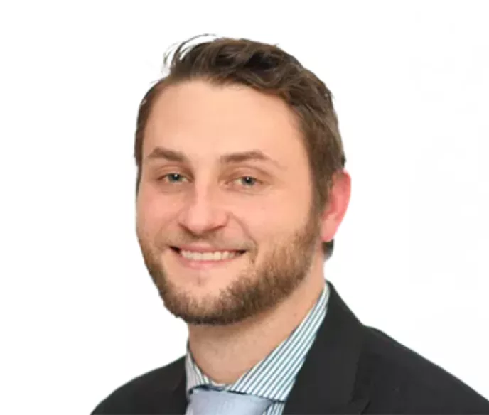 Man wearing a blazer and collared shirt