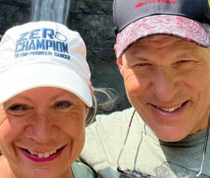 Scott and Katy Freitag wearing baseball caps