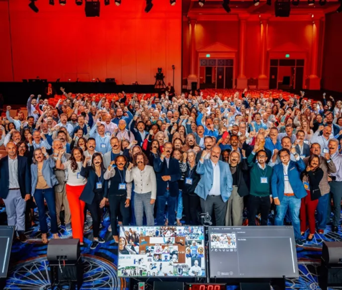 Group photo in auditorium of Pfizer team