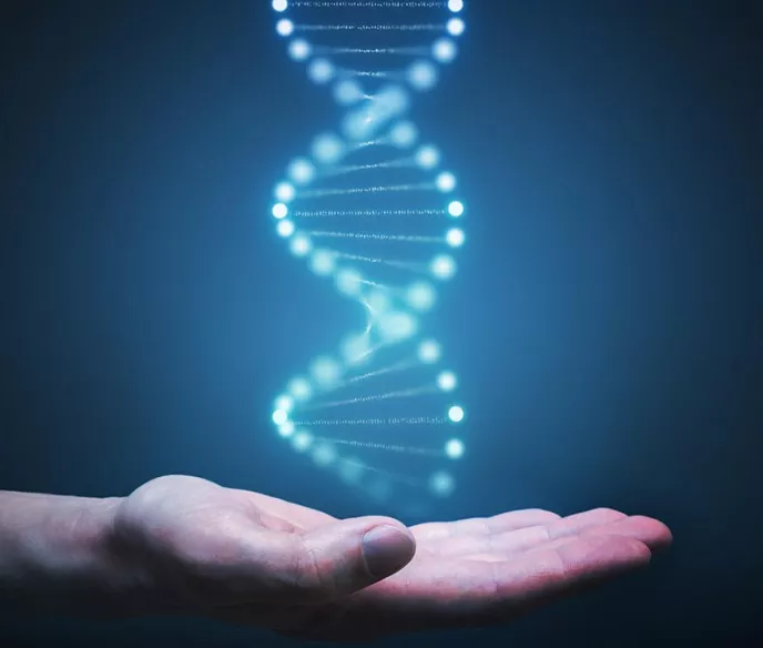 A hand underneath a blue glowing DNA strand