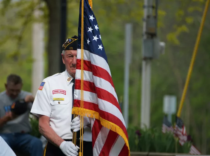Honor Guard member holding the flag of USA