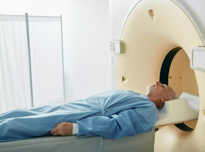 Man laying on table about to receive radiation