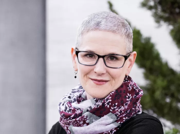 Woman with short grey hair and black glasses, Allison Hagenbuch