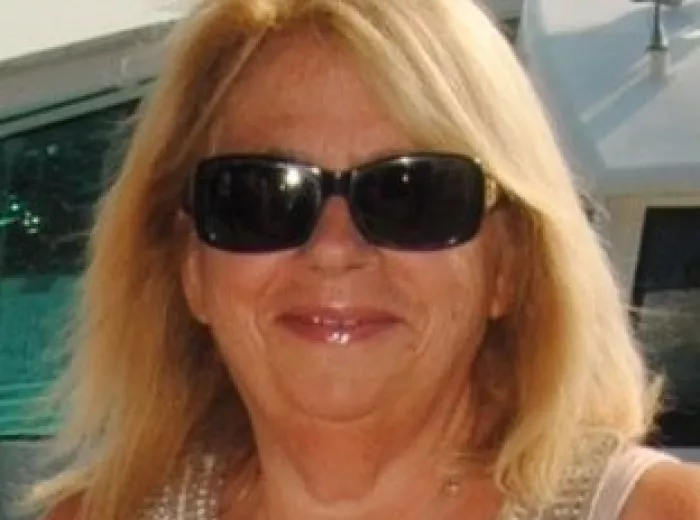 Woman with blond hair and dark sunglasses, Cheryl Nikituk