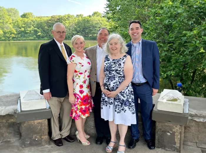 ZERO President & CEO with family standing in front of a lake