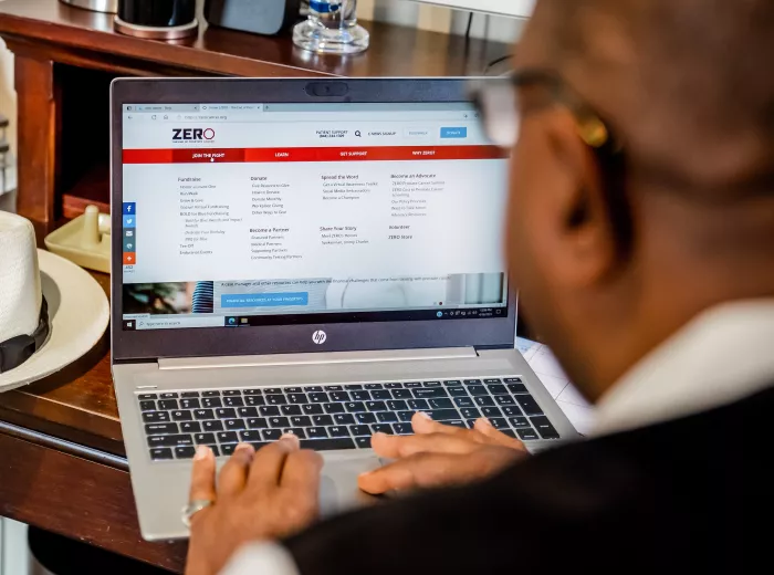 African American man working on a laptop