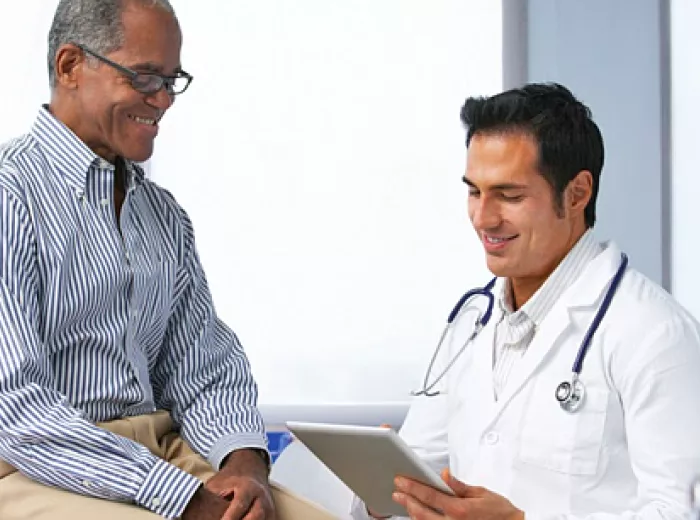 African American male patient talking to a male doctor