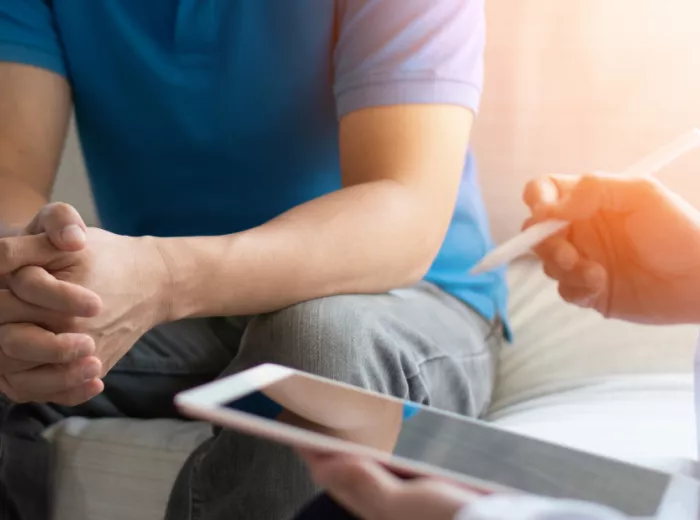 Doctor taking notes during a patient's appointment