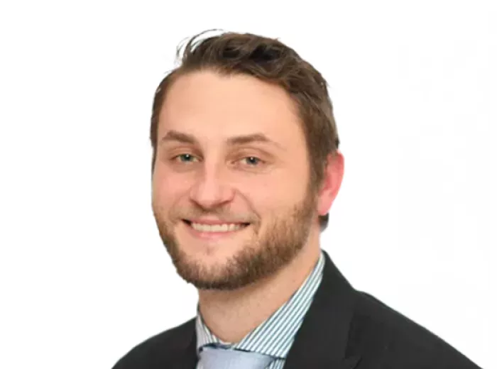 Man wearing a blazer and collared shirt