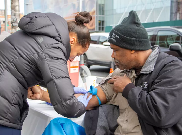 A man holding his sleeve up