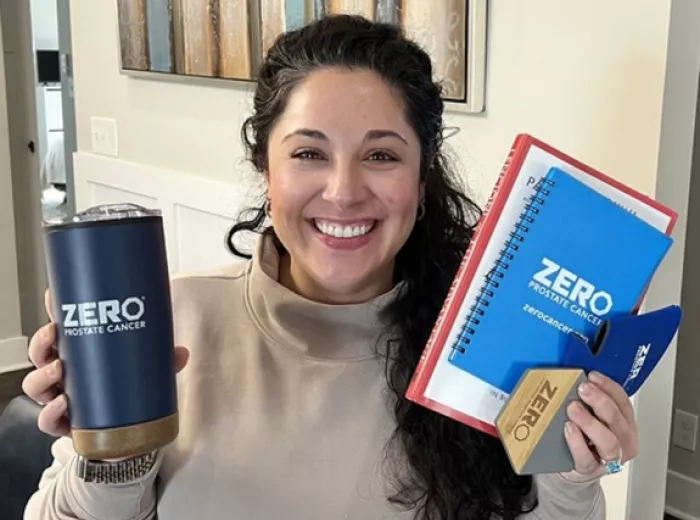 Picture of Victoria Vighetto holding ZERO swag such as a bright blue notebook and a thermos
