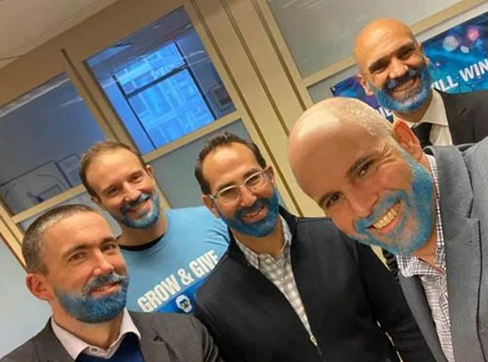 Office workers with blue beards for Grow and Give