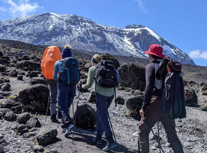 Hikers moving up the side of a mountain