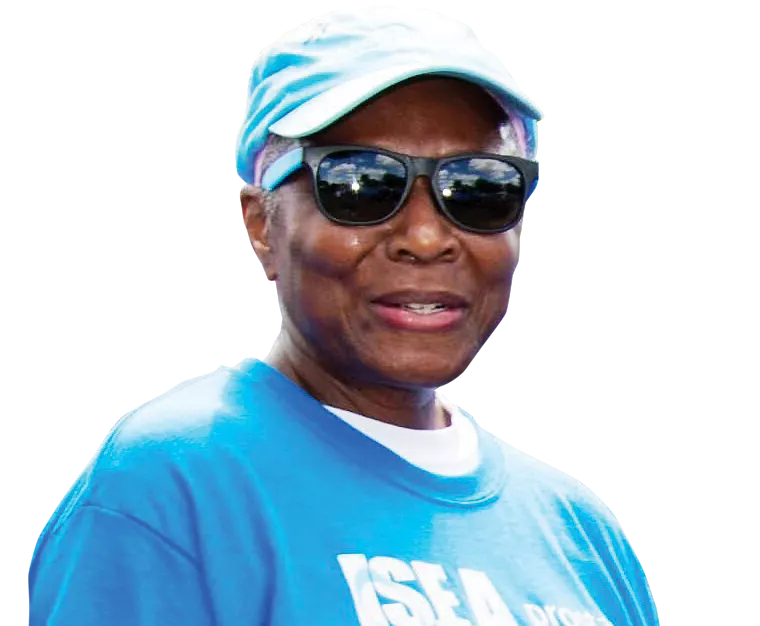 African American woman wearing a blue cap and a blue t-shirt