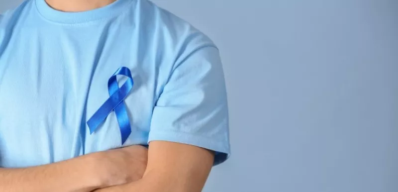 Man Wearing A Blue Ribbon For Prostate Cancer