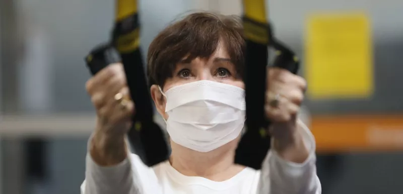 Woman Exercising With Mask