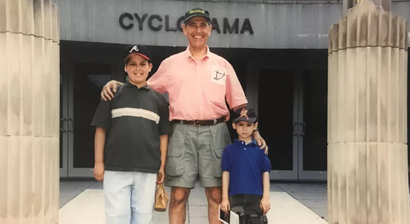 Hal berger as a kid with his grandpa and brother in front of a Cyclorama building