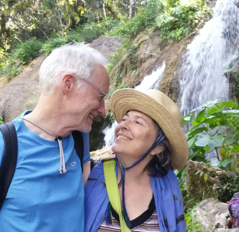 James and wife at waterfalls staring happily at each other