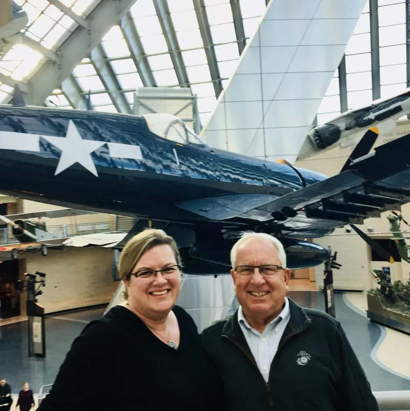Shawn and her father at the US Marine Corps Memorial Museum in front of a fighter jet
