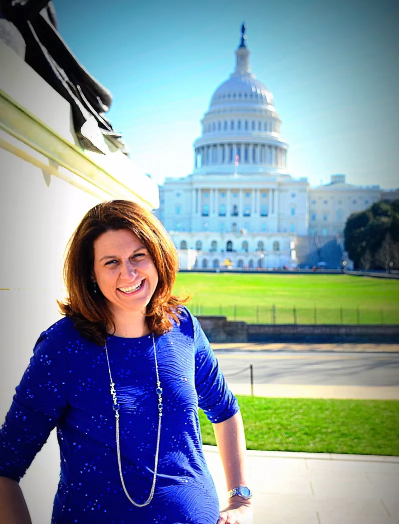 Stephanie Mueller at Capitol Hill in a bright blue dress