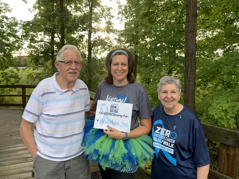 Stephanie Mueller sporting a tutu next to her parents at a charity run/walk event
