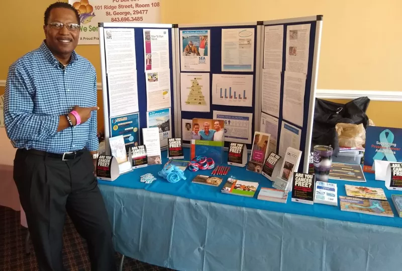 Tony Minter at an Awareness Table about prostate cancer