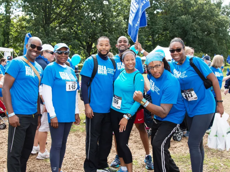 Yvonne and Team Poindexter in matching Blue Shirts