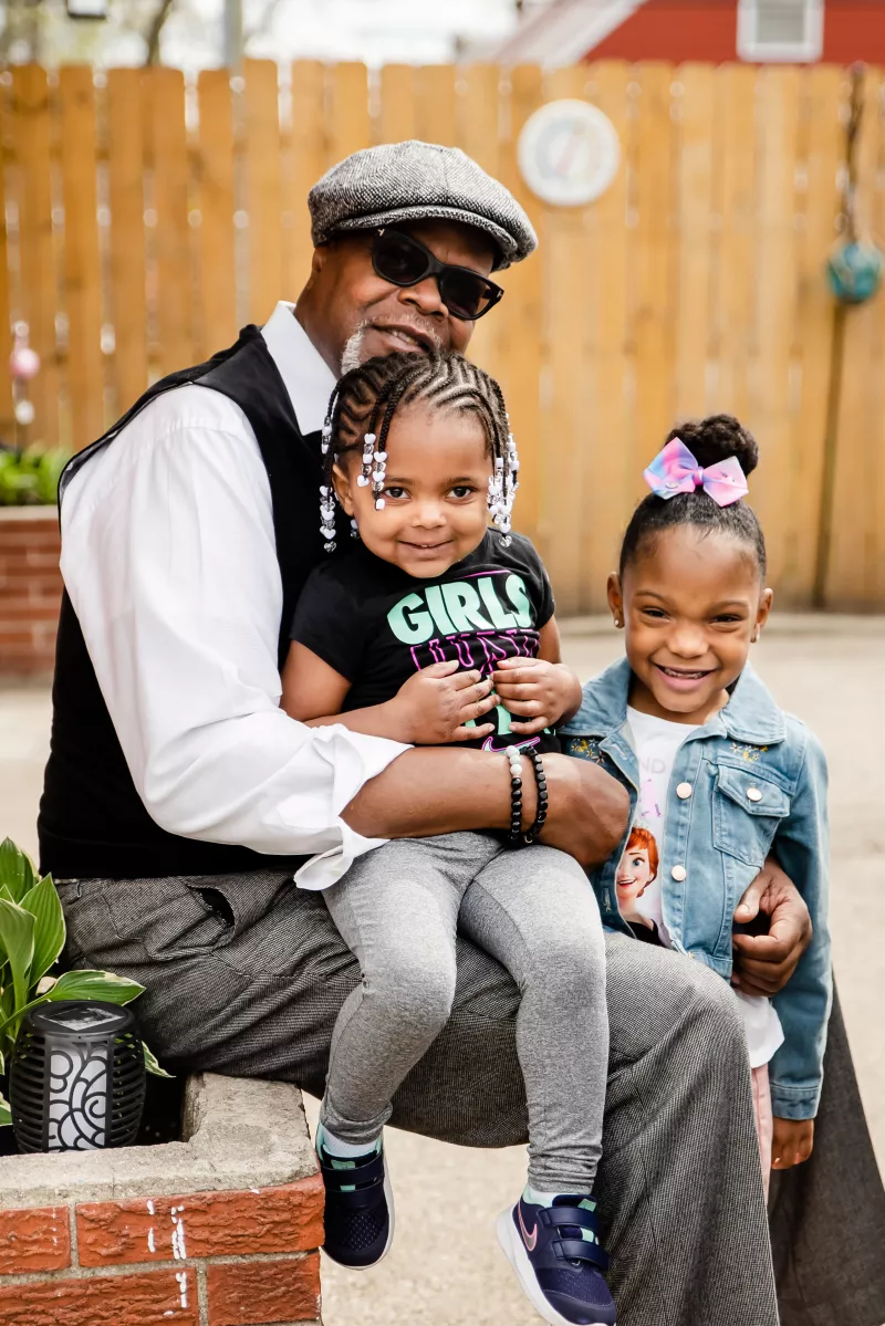 CC Williams with his granddaughters in Detroit