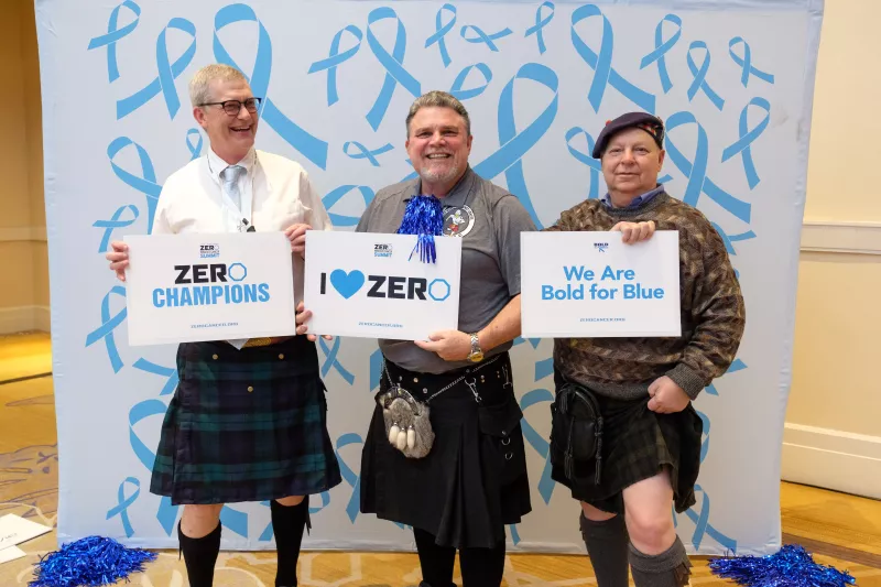 Three men in Scottish kilts with End Prostate Cancer signs
