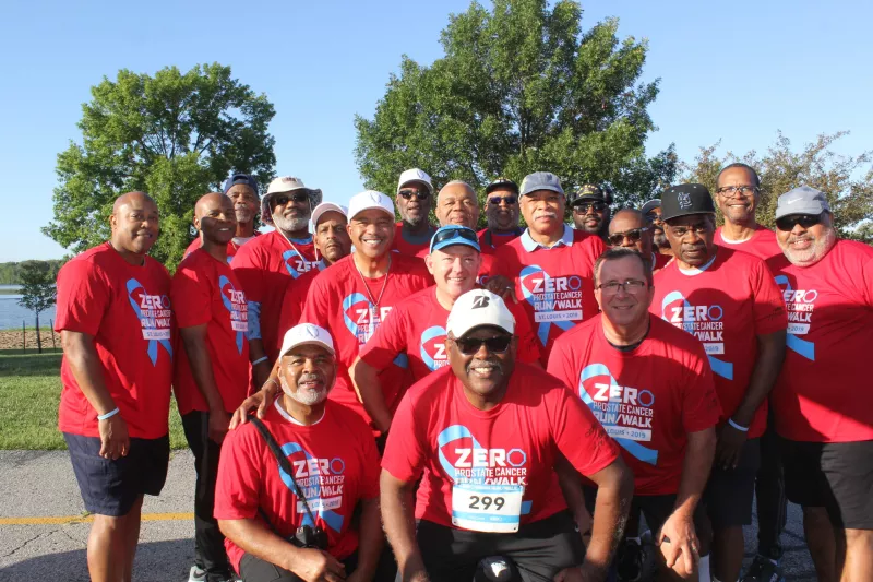 A big group of men dressed up in red ZERO Prostate Cancer RunWalk t-shirts