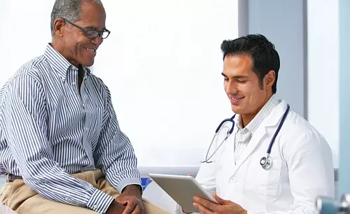 African American male patient talking to a male doctor