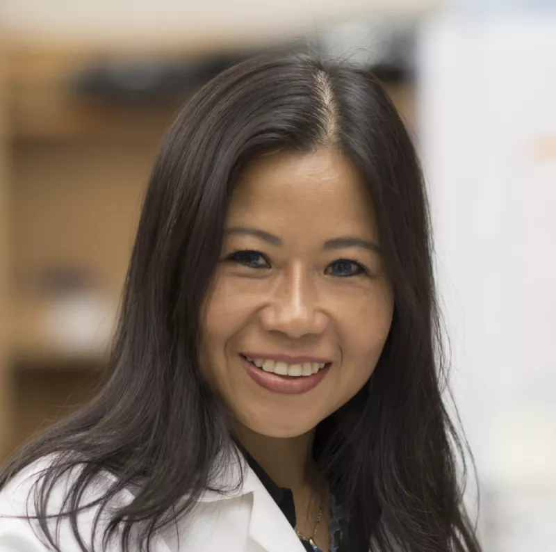 Asian female doctor in a white lab coat