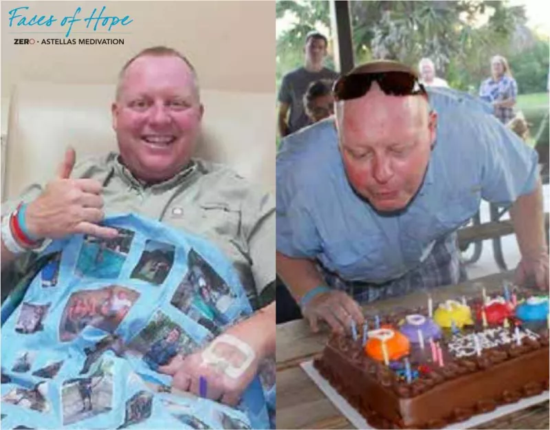 A chubby man blowing candles on a birthday cake
