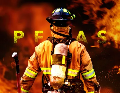 Firefighter into a fire shot from the back